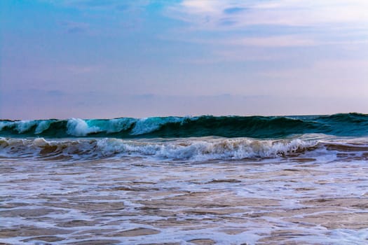 Beautiful sunny landscape panorama with huge powerful waves and clear water in Bentota Beach Galle District Southern Province Sri Lanka island.