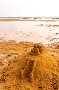 Temple of sand on the beach like a sandcastle in Bentota Beach in Sri Lanka.