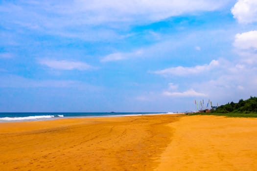 Beautiful sunny landscape panorama with huge powerful waves and clear water in Bentota Beach Galle District Southern Province Sri Lanka island.