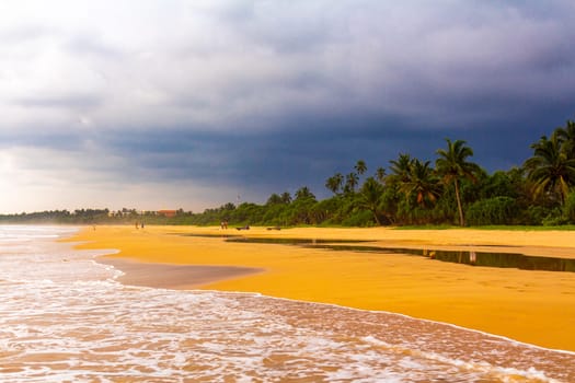 Beautiful sunny landscape panorama with huge powerful waves and clear water in Bentota Beach Galle District Southern Province Sri Lanka island.