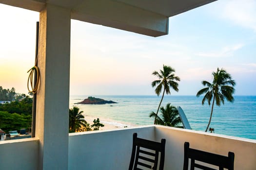 Beautiful paradise tropical beach with palm trees waves and sea water view in Mirissa Beach Southern Province Sri Lanka.