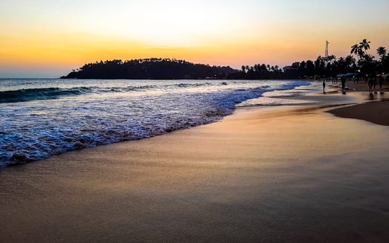 Beautiful colorful sunset on the beach in Mirissa Beach Matara District Southern Province Sri Lanka.