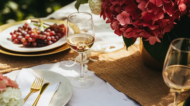 Wedding or formal dinner holiday celebration tablescape with hydrangea flowers in the English countryside garden, table setting and wine, floral table decor for family dinner party, home styling inspiration