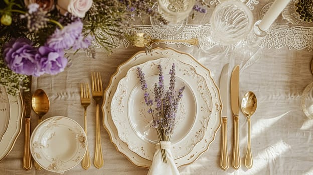 Wedding table decoration with lavender flowers, sweets, cake and candles