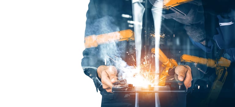 MLP Mechanized industry robot arm and factory worker double exposure. Concept of robotics technology for industrial revolution and automated manufacturing process.
