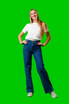 Young Woman in White Shirt Posing for Picture against green background in studio