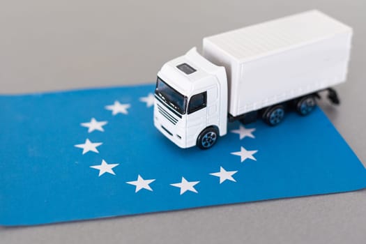 Truck on the European Union flag. Cargo Delivery in the EU concept, 3D rendering. High quality photo