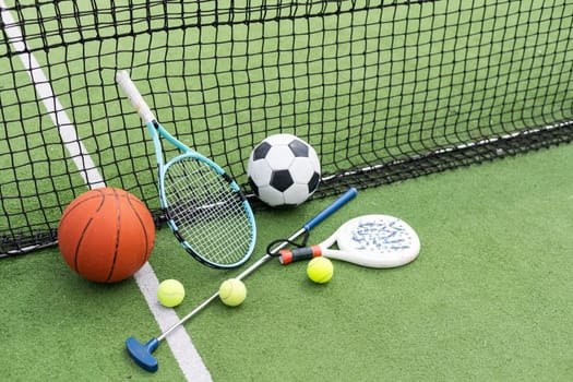 Sport games background - basketball, soccer ball, rackets, sneakers - copy space. High quality photo