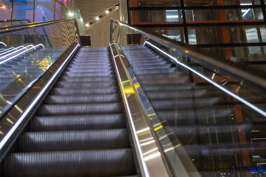 Modern luxury escalators with staircase at airport.