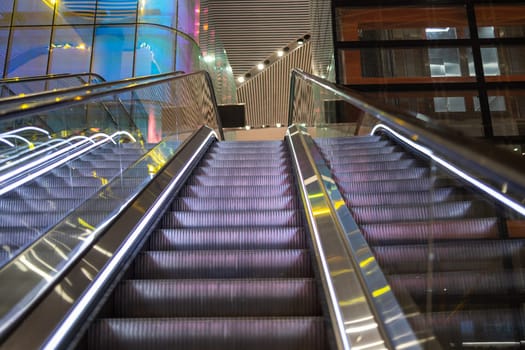 Modern luxury escalators with staircase at airport.