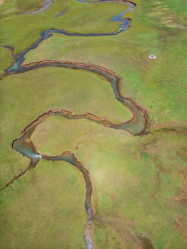 The meander in Antalya Sobucimen plateau. Aerial view of complex waterways weaving  through lush green fields