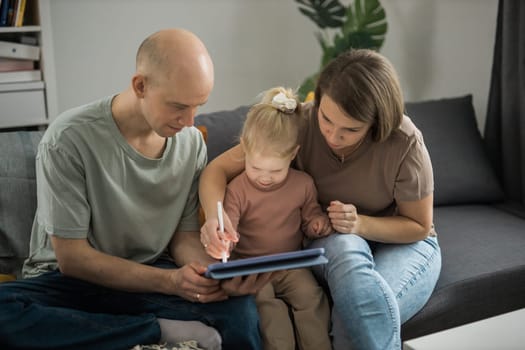 Deaf kid with hearing aid cochlear implant have fun with parents - Hear aid and medicine innovating technology and diversity