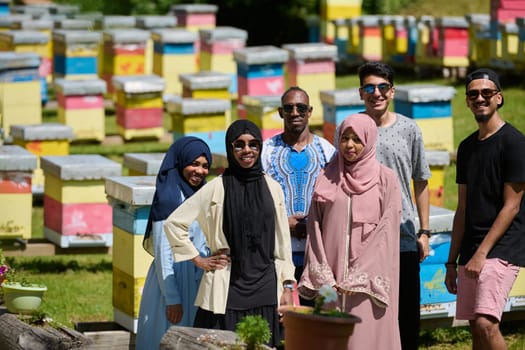 A diverse group of young friends and entrepreneurs explore small honey production businesses in the natural setting of the countryside