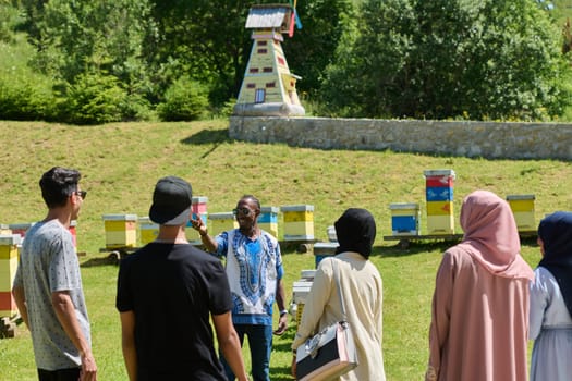 A diverse group of young friends and entrepreneurs explore small honey production businesses in the natural setting of the countryside