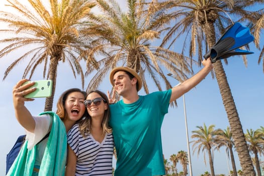 Group of friends taking selfie happy laughing in the beach in summer. High quality photo