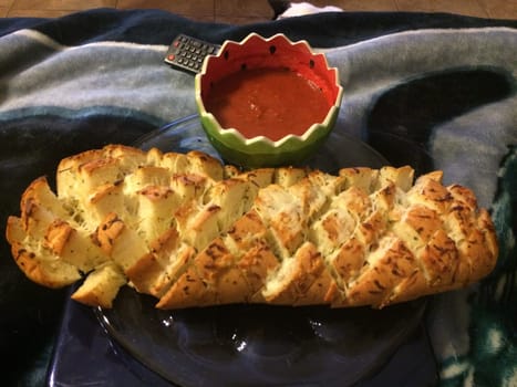 Pull Apart Garlic Bread Loaf with Marinara Dipping Sauce. High quality photo