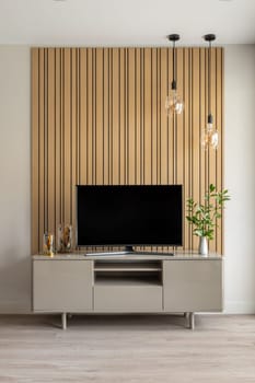 Close-up of a TV stand showcasing modern design and minimalism in a home setting.