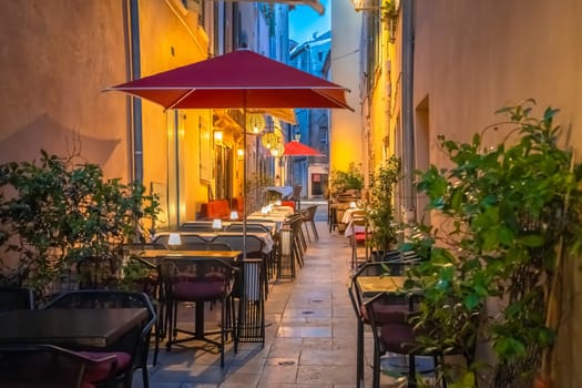 Saint Tropez stone alley with restaurants evening view, luxuty travel destination in southern France