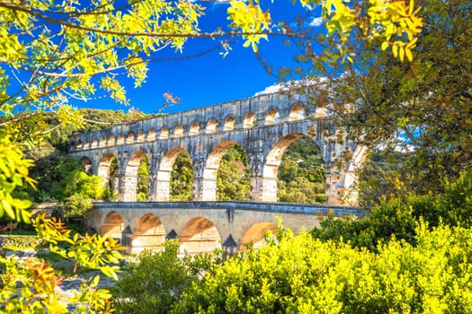 The Pont du Gard ancient Roman aqueduct bridge built in the first century AD to carry water to Nîmes. It crosses the river Gardon near the town of Vers-Pont-du-Gard in southern France. 