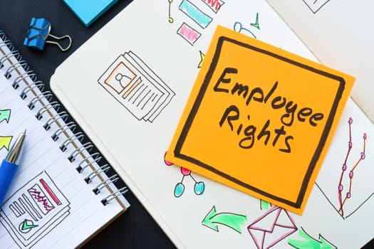 Note Employee rights and open notebooks with marks.