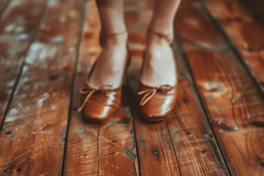 The close up picture of the shoe of ballet dancer in their rehearsal room with wooden floor, the ballet dancer require skill like balancing, dancing technique, physical training and experience. AIG43.