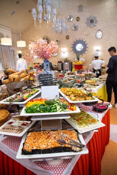 Buffet table in the hotel with various dishes.