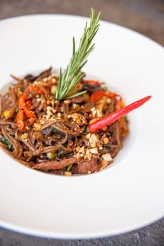 spaghetti pasta with red pepper and rosemary.