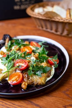 top view salad with cherry tomatoes, banana, chickpeas and herbs.