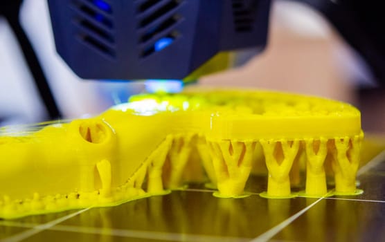 3D printer printing object close-up. Process creating three-dimensional model on 3d printer. Additive printer technology. 3D Prototyping. 3D design modeling. New modern innovation printing technology