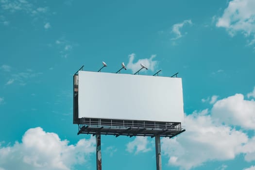 Several birds are perched on top of a billboard, with a clear sky in the background. mockup