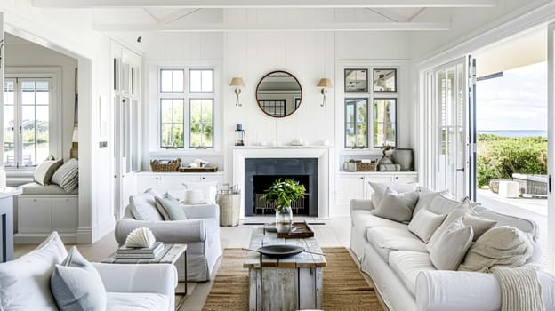 Interior of a living room with white walls, sofa and cushions. Sitting room in coastal cottage with sea view. Luxury lounge room