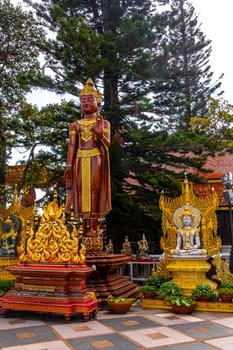 Buddha sculpture figure statue at golden gold Wat Phra That Doi Suthep temple temples building in Chiang Mai Amphoe Mueang Chiang Mai Thailand in Southeastasia Asia.