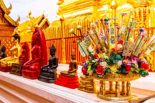 Buddha sculture figure statue at golden gold Wat Phra That Doi Suthep temple temples building in Chiang Mai Amphoe Mueang Chiang Mai Thailand in Southeastasia Asia.