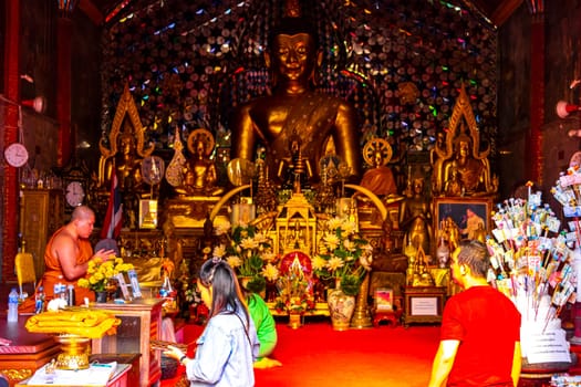 Buddha sculture figure statue at golden gold Wat Phra That Doi Suthep temple temples building in Chiang Mai Amphoe Mueang Chiang Mai Thailand in Southeastasia Asia.