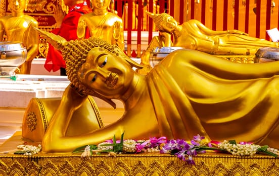 Buddha sculture figure statue at golden gold Wat Phra That Doi Suthep temple temples building in Chiang Mai Amphoe Mueang Chiang Mai Thailand in Southeastasia Asia.