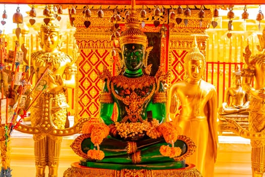 Buddha sculture figure statue at golden gold Wat Phra That Doi Suthep temple temples building in Chiang Mai Amphoe Mueang Chiang Mai Thailand in Southeastasia Asia.