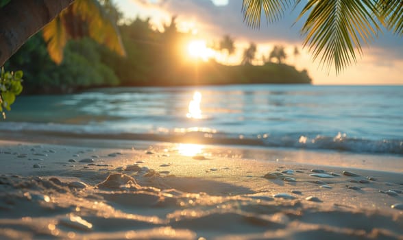 The sun dips below the horizon of a tropical beach, casting warm colors across the sky and water.