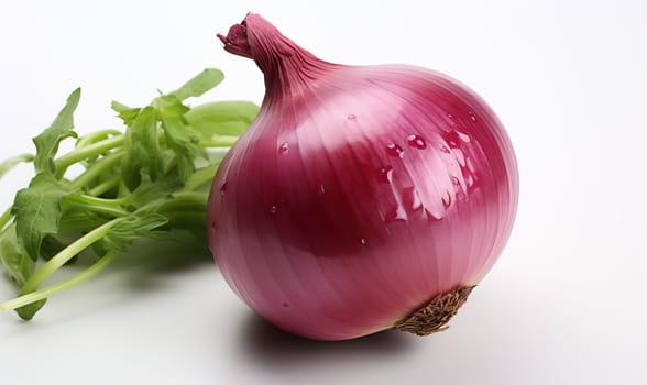 A close-up shot of an onion bulb next to a leaf of green lettuce.