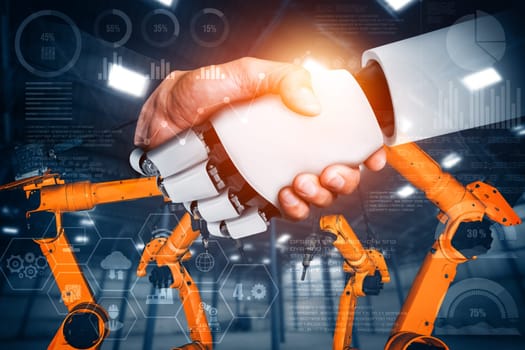 MLP Mechanized industry robot and human worker working together in future factory. Concept of artificial intelligence for industrial revolution and automation manufacturing process.
