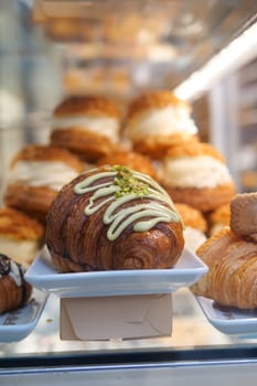 fresh baked croissant in a bakery .