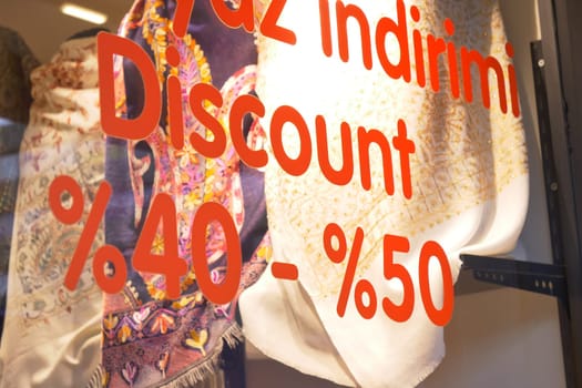 Large red Sale text letters on red background on clothing store