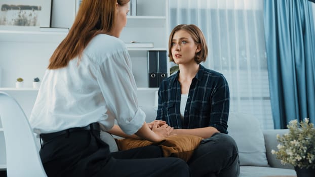 Supportive and comforting hands cheering up depressed patient person or stressed mind with prim empathy. Psychologist reassuring stressful and sad patient in clinic.