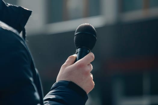 Man hands holding microphone on stand, Professional Media interview.