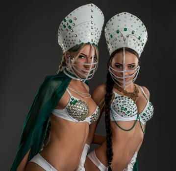 Image of sexy beauties posing in costumes for erotic dance