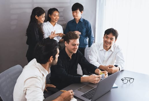 Group of diverse office worker employee working together on strategic business marketing planning in corporate office room. Positive teamwork in business workplace concept. Prudent