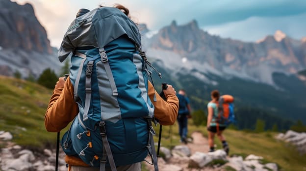 A bunch of backpackers are trekking up the majestic mountain, surrounded by the vast natural landscape, enjoying the sky, plants, and soil along the way. AIG41