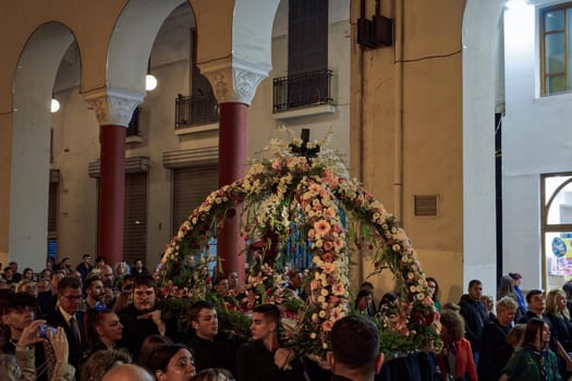 Thessaloniki, Greece Good Friday Orthodox Easter Epitaph procession. Crowd attending the commemoration of decorated with flowers Epitafios in the streets of the city centre.