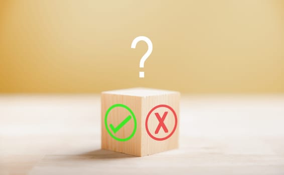 Wooden block illustrates choice with green check mark and red x. Decision-making concept highlighted. Think With Yes Or No Choice.