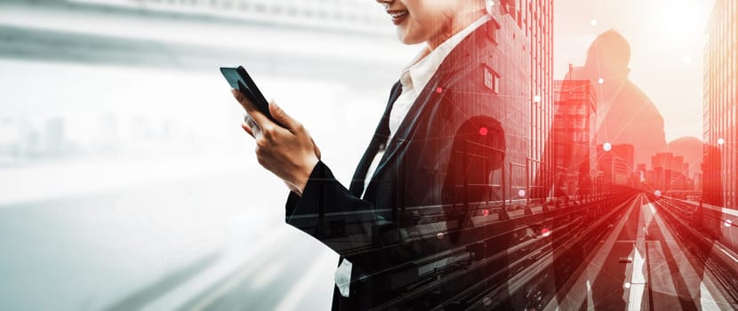 Double Exposure Image of Business Communication Network Technology Concept - Business people using smartphone or mobile phone device on modern cityscape background. uds