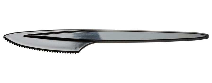 Black plastic disposable knife on isolated background, close up